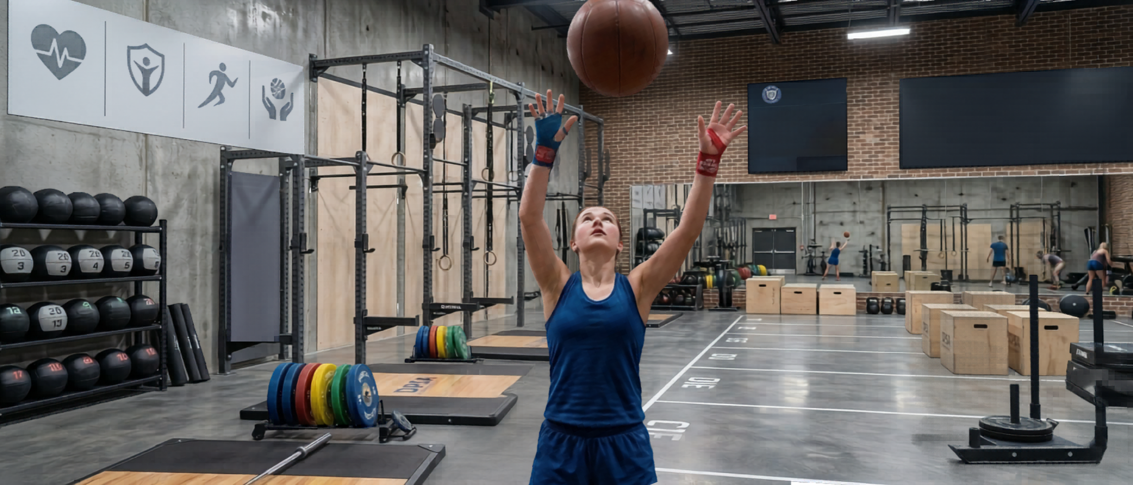 A 15-year-old female athlete throwing a medicine ball vertically toward a high target to visualize athletes reclaiming respect for the human design.